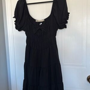 Fun and flowy little black dress.